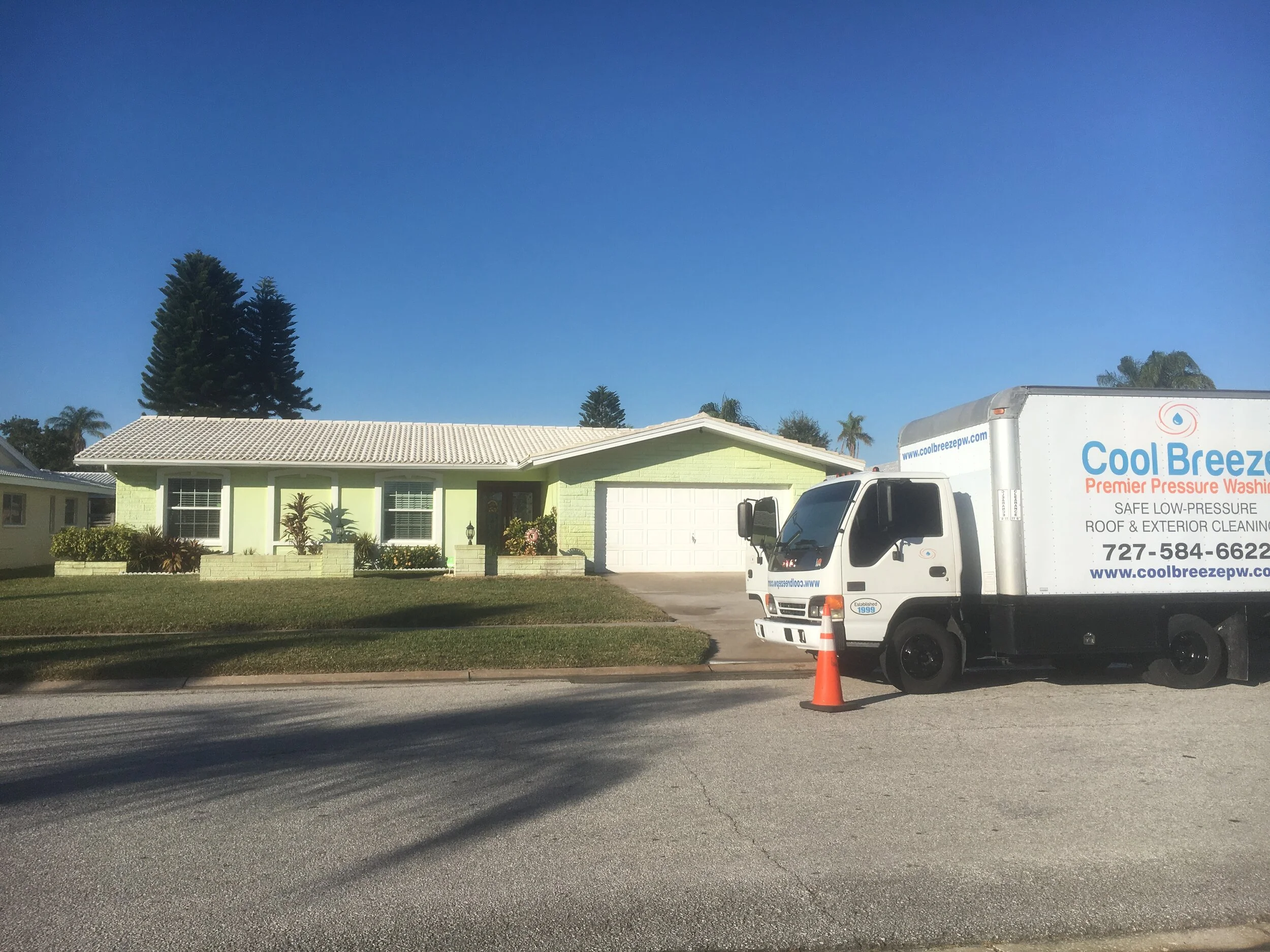 The same white tile roof in Largo, FL, after a soft wash